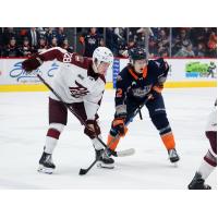 Peterborough Petes left wing Brennan Faulkner (left) vs. the Flint Firebirds