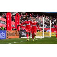 Chicago Fire FC midfielder Jonathan Bamba (left) and forward Hugo Cuypers