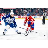 Syracuse Crunch defenseman Steven Santini (left) vs. the Laval Rocket