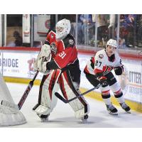 Belleville Senators centre Keean Washkurak behind the Utica Comets net
