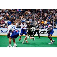 Vancouver Warriors' Curtis Dickson battles Toronto Rock's Josh Jubenville, Rocbert Hudson, and Challen Rogers