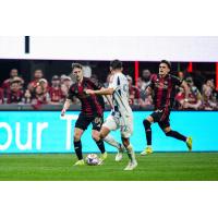 Atlanta United's Alexey Miranchuk and Tomás Jacob and Real Salt Lake's Noel Caliskan in action