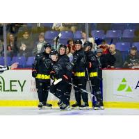 Vancouver Giants gather after a goal against the Kelowna Rockets