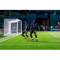 Oakland Roots' Peter Wilson and Neveal Hackshaw on the field