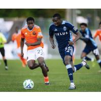Striker Cyprian Kachwele (right) with Whitecaps FC 2