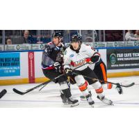 Wichita Thunder's Robert Kincaid and Kansas City Mavericks' Tyler Schleppe in action
