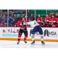 Belleville Senators centre Keean Washkurak (left) fights the Springfield Thunderbirds