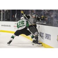 Texas Stars defenseman Michael Karow delivers a blow against the Henderson Silver Knights