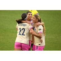 Lia Godfrey, Kenza Dali and Kimmi Ascanio (l to r) of San Diego Wave FC celebrate following the winning goal