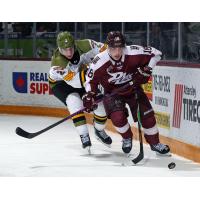 Peterborough Petes right wing Francis Parish (right) vs. the North Bay Battalion