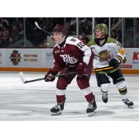 Peterborough Petes centre Adam Levac (left) vs. the North Bay Battalion