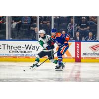 Texas Stars' Kole Lind and Bakersfield Condors' Alec Regula in action