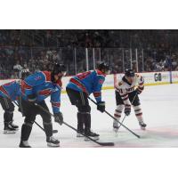 Tahoe Knight Monsters' Jake Durflinger, Linden Alger, and Anthony Collins and Rapid City Rush's Cole Tymkin on the ice