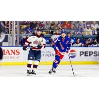 Saginaw Spirit center Carson Harmer (left) vs. the Kitchener Rangers