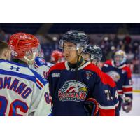 Saginaw Spirit defenseman James Guo shakes hands with the Kitchener Rangers