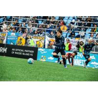 Rhode Island FC forward Leo Afonso races to the ball