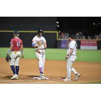 Fayetteville Woodpeckers' Kevin Alvarez and Tanner Montgomery and Wilson Warbirds' Frederi Montero on game night