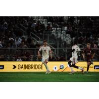 Phoenix Rising's Luke Biasi and Jean-Eric Moursou and Sacramento Republic FC's Blake Willey in action