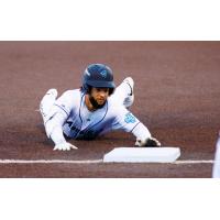 Carlos Jimenez of the Everett AquaSox slides into third