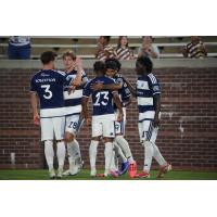 Chattanooga FC exchanges congratulations after a goal against Orlando City B