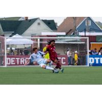 Detroit City FC defender Devon Amoo-Mensah (right) vs. the Chicago Fire