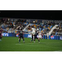 Rhode Island FC forward JJ Williams goes up for a header against the New England Revolution