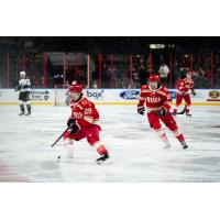 Rapid City Rush forward Ryan Chyzowski (left) and defenseman Bobby Russell