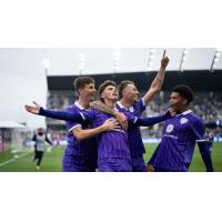 Louisville City FC congratulate Jansen Wilson after his goal