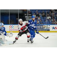Syracuse Crunch defenseman Chris Harpur (right) vs. the Belleville Senators