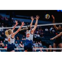 Grand Rapids Rise outside hitter Carli Snyder (4) and middle blocker Berkeley Oblad (12)