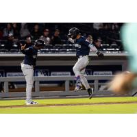 Kenedy Corona of the Somerset Patriots (right) rounds the bases