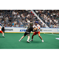 Vancouver Warriors' Curtis Dickson battles Halifax Thunderbirds' Nonkon Thompson