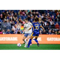 Reign FC forward Maddie Mercado with possession