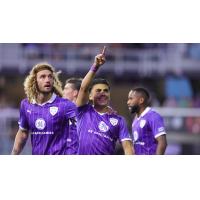 Louisville City FC gather after Ray Serrano's goal