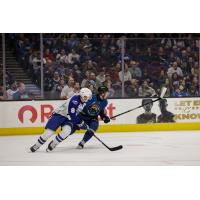 Syracuse Crunch defenseman Tommy Miller (left) vs. the Cleveland Monsters