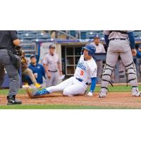 Chris Newell slides home for the Tulsa Drillers