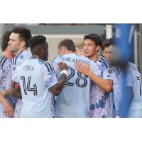 San Jose Earthquakes exchange congratulations after a goal against Minnesota United FC