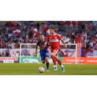 FC Cincinnati's Pavel Bucha and Chicago Fire FC's Hugo Cuypers in action