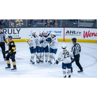 Springfield Thunderbirds gather after a Dillon Dube goal