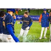 A.J. Ewing of the Syracuse Mets gets doused