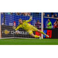 Chicago Fire FC goalkeeper Chris Brady prepares to smother a shot