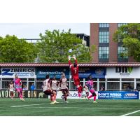 Detroit City FC goalkeeper Carlos Herrera leaps to make a save