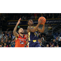 Edmonton Stinger eye the basket against the Vancouver Bandits