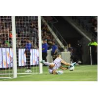 Angel City Football Club goalkeeper Angelina Anderson smothers a shot