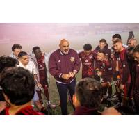 Detroit City FC huddle around Head Coach Danny Dichio