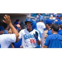Josue De Paula celebrates in the Tulsa Drillers dugout