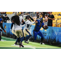 Minnesota Monsters defensive lineman Claude Davis delivers a stiff arm