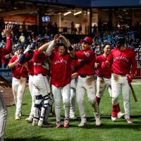 Tsung-Che Cheng is mobbed by Worcester Red Sox teammates