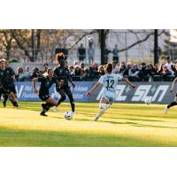 AFC Toronto midfielder Zoe Burns (right)