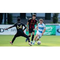 Atlanta United 2's Mohamed Cisset and Ignacio Suarez-Couri and Chicago Fire II's Chase Nagle on the field